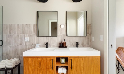 a bathroom with a sink and mirror