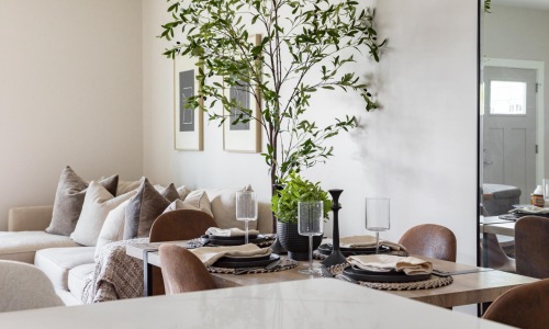 a living room with a white couch and a coffee table