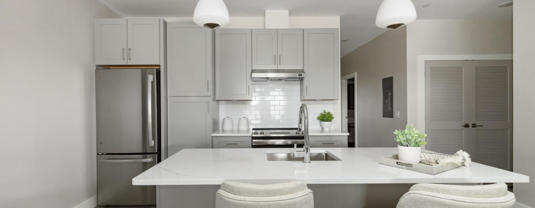 a kitchen with white cabinets